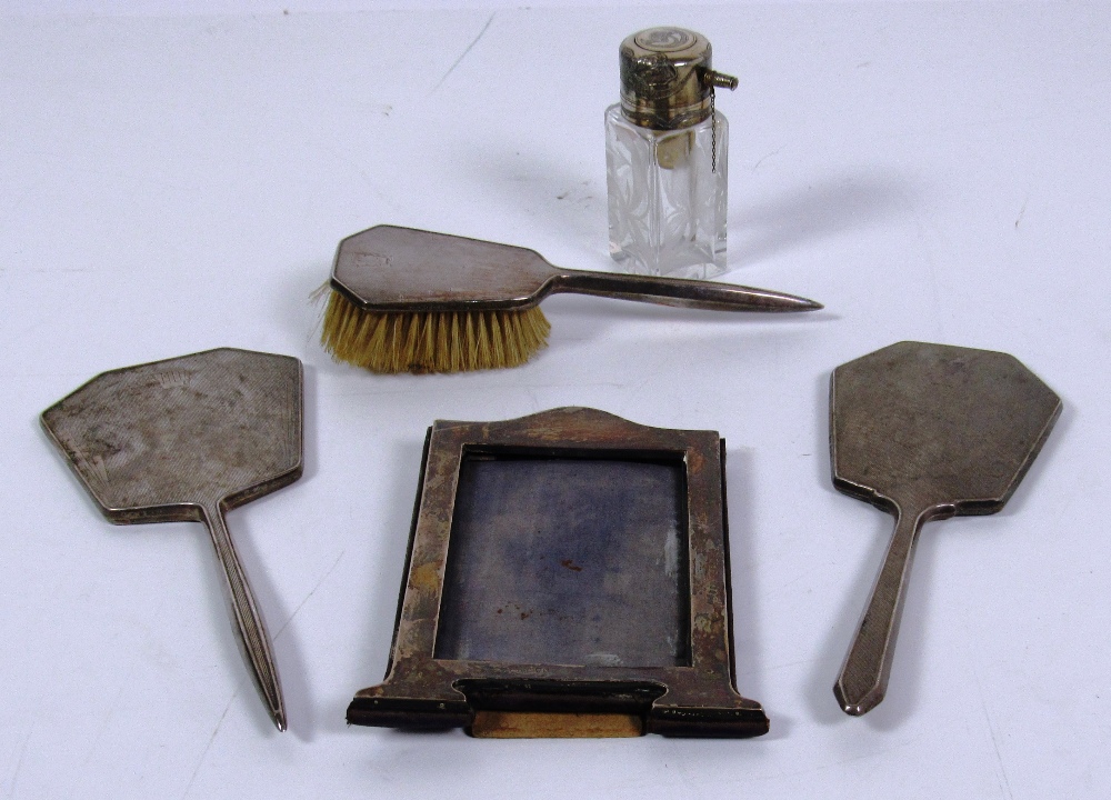 Two Birmingham silver Hand Mirrors, with machine turned decoration, a similar silver hand Brush,