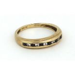 A 9ct gold Ring, with inset single row of sapphire and white stones.