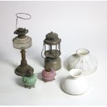 A large collection of late 19th Century oil and gas Lights, modern lamps, glass shades, etc. A lot.