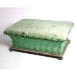 A large rectangular mahogany framed upholstered Ottoman, with lift top and turned bun feet.