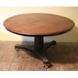 A Victorian circular mahogany Dining Table, on pillar support with triform base,