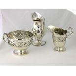 A silver baluster shaped Cream Jug, with bead edge on stem foot, London 1893,