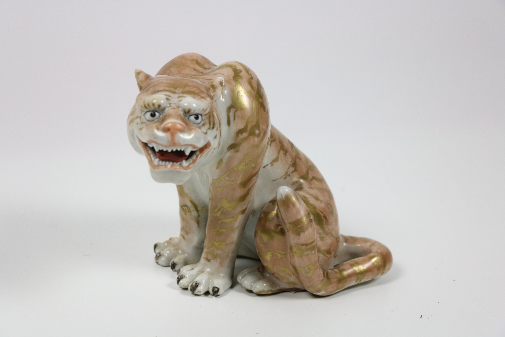 A Japanese porcelain Model of a Tiger, Taisho period,
