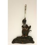 A Victorian cast iron Door Stop, modelled as a Scottish Highlander, with extended handle, approx.