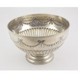 An attractive English silver Punch Bowl, decorated in the Adams taste with bows and swags,