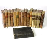 Classical & Religious interest: approx. 34 volumes, leather bound, the two lowest shelves.