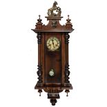 A Victorian walnut cased Vienna Wall Clock, with horse surmounted,