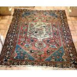 A 19th Century square Oriental red ground Carpet,