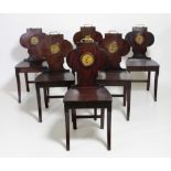 A rare set of 6 fine quality Irish Regency mahogany armorial Hall Chairs,