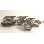 A collection of 8 varied engraved and pierced silver Bon Bon Dishes.