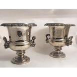 A good heavy pair of 19th Century silver plated on copper Wine Coolers, with vine decorated rims,