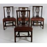 A set of 4 mahogany Irish Chippendale period Dining or Side Chairs, each with pierced splat back,