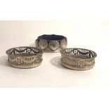 An attractive small pair of Birmingham silver pierced and bright cut Wine Coasters, c.