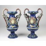 A pair of early Majolica two handled Urns, with naturalistic branch handles and inter woven foliage,