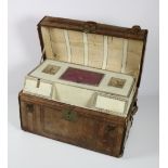 A fine rare large tooled and embossed American leather humpback Travel Trunk,