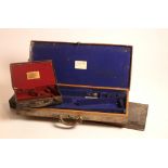A good brass bound leather Gun-Case for a pair of shotguns, labelled 'H.