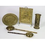 Brassware: a large oval embossed decorated Dish, a cylindrical Umbrella Stand of similar design,