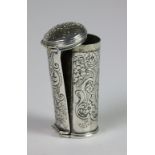 A late 18th Century cylindrical silver Nut Meg Grater, crested and chased with scrolling foliage,
