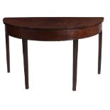 A 19th Century mahogany D end Table, the plain top and frieze on square tapering legs.