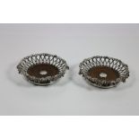A fine unusual pair of 19th Century silver plated wire work Wine Coasters, by Elkington & Co.