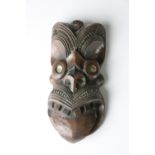 A late 19th Century / early 20th Century carved wooden Maori Mask,