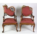 An almost matching pair of 19th Century French carved "Throne" Chairs,