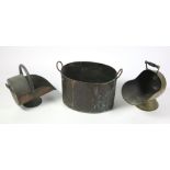 A large copper two handled Pot, two large antique steel Pots, a heavy copper Coal Helmet,
