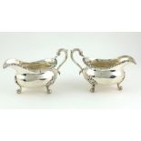 A very heavy pair of early George IV English silver Sauceboats,