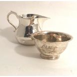 A small heavy plain silver Water Jug, approx.