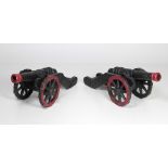 A pair of heavy 19th Century Floor Cannons, with decorated design, painted black and red,