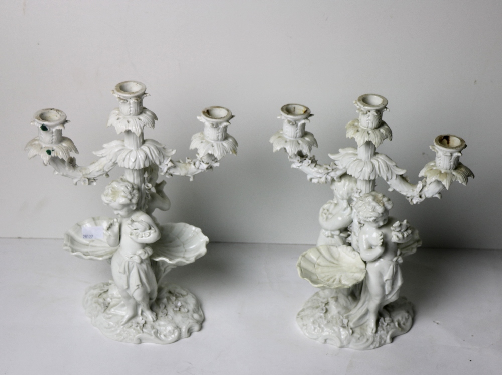 A pair of 19th Century Meissen blanc-de-chine porcelain figural Candelabra,