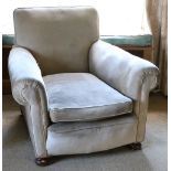 A pair of Edwardian Easy Armchairs, on round feet, covered in grey fabric,