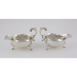 A very good pair of early George III English silver Sauceboats, with serrated edge,