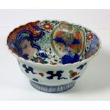 A Chinese Kangxi deep Bowl, painted with flowers, dragons, peacocks etc., with moulded edge, approx.