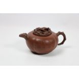 A Chinese Yixing Teapot, of pumpkin form, incised with calligraphy and a landscape,