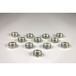 A set of 12 Indian silver (925) Napkin Rings, each chased in relief with camels, 267grs.