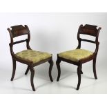 A pair of unusual Regency period mahogany Side Chairs, with moulded and scroll backs,