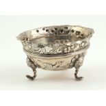 A small heavy Irish Georgian silver Sugar Bowl, with embossed decoration of flowers,