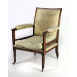 A large 19th Century mahogany framed bergere type Library Chair, now upholstered,