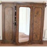 A Victorian walnut breakfront three door Wardrobe,