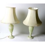 A pair of marble urn shaped Table Lamps, with cream shades.