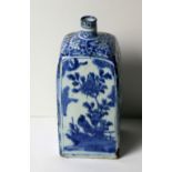 An early blue and white delph type Bottle Vase, of square form, decorated with trees and birds,