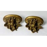 A pair of 19th Century style gilded plaster Wall Brackets, with cherub uprights.