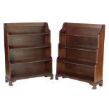 An attractive pair of Georgian style mahogany waterfall four shelf Bookcases, on bracket feet,