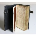 Binding etc: The Book of Common Prayer, 12mo L. 1703. title within red & black ruled borders, a.e.g.