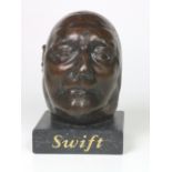 Swift (Jonathan) A cast bronze Death Mask of Jonathan Swift, on a square limestone, base,