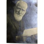 Photographs: Good half length Portrait George Bernard Shaw, looking right, holding an open book,