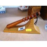 DECORATIVE TRUNCHEON ON STAND APPROX H: 4" X 7"