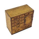 Japanese artist's cabinet with worked basketry, with an arrangement of small drawers and a