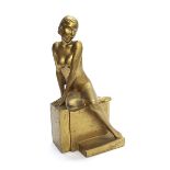 After Guido Leonardi - gilded plaster figure of a seated nude lady, impressed monogram and marks